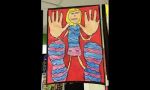 Students’ art work -girl holding hands up